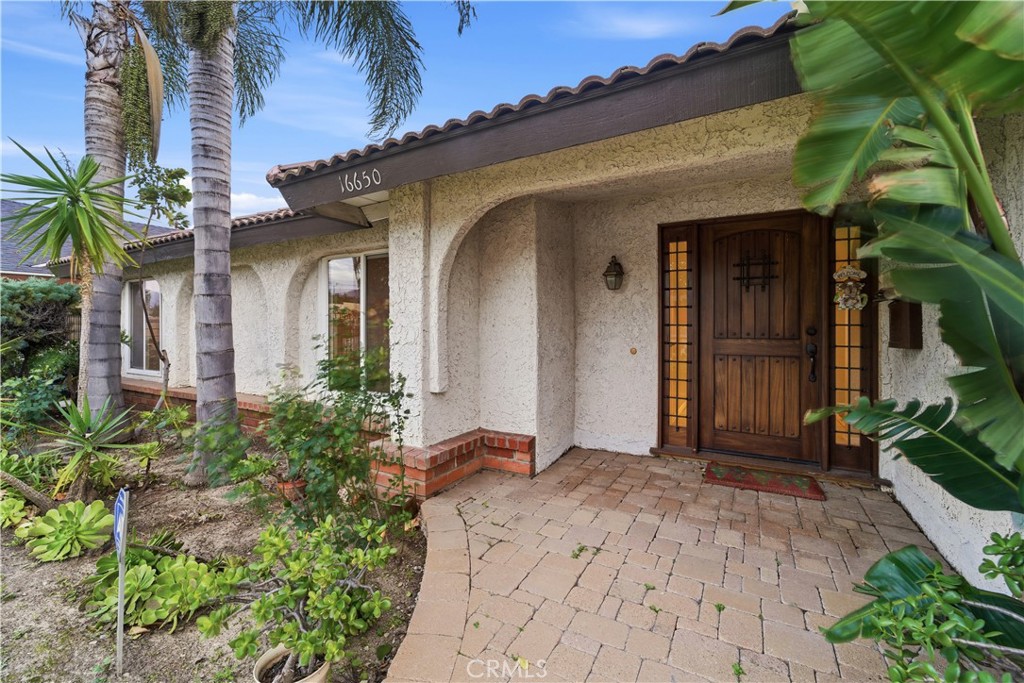 16650 Rinaldi Street Granada Hills, CA 91344 - Photo 2 of 35 a view of a house with a flower garden