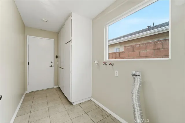 a view of a house with a backyard and garage