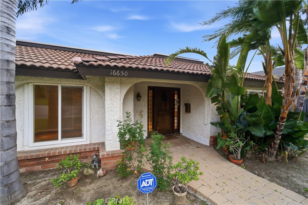 16650 Rinaldi Street Granada Hills, CA 91344 - Photo 32 of 35 a view of a house with potted plants