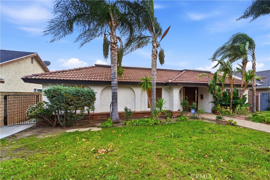 16650 Rinaldi Street Granada Hills, CA 91344 - Photo 33 of 35 a front view of a house with garden