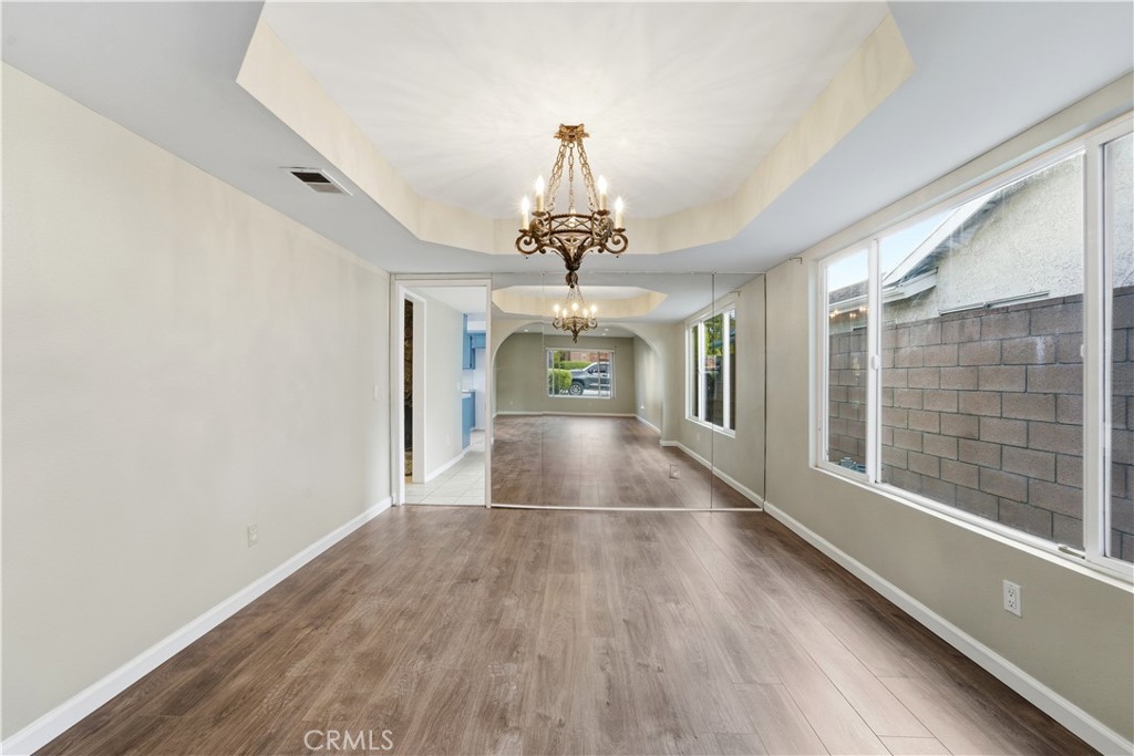16650 Rinaldi Street Granada Hills, CA 91344 - Photo 6 of 35 wooden floor in an empty room with a window