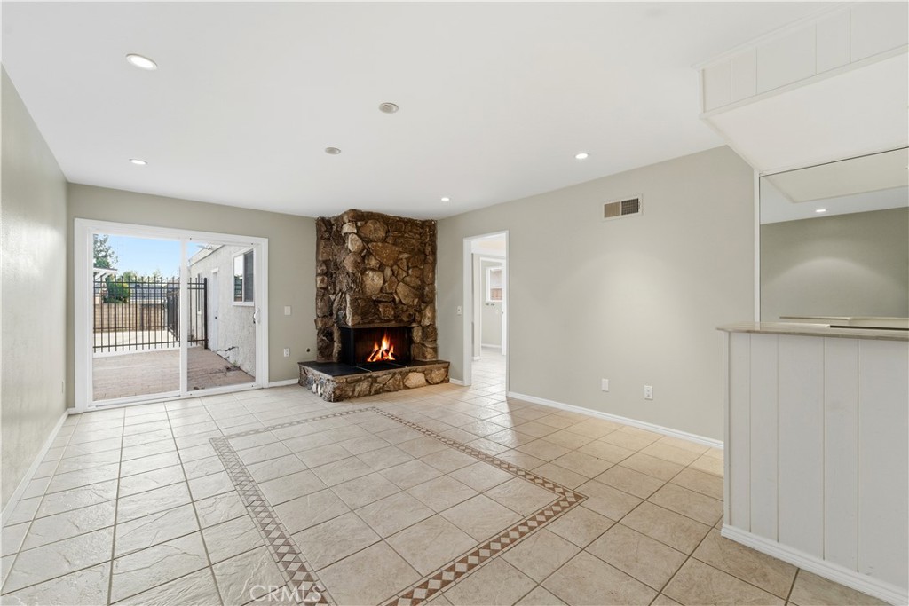16650 Rinaldi Street Granada Hills, CA 91344 - Photo 7 of 35 a view of a room with gym equipment and mirror