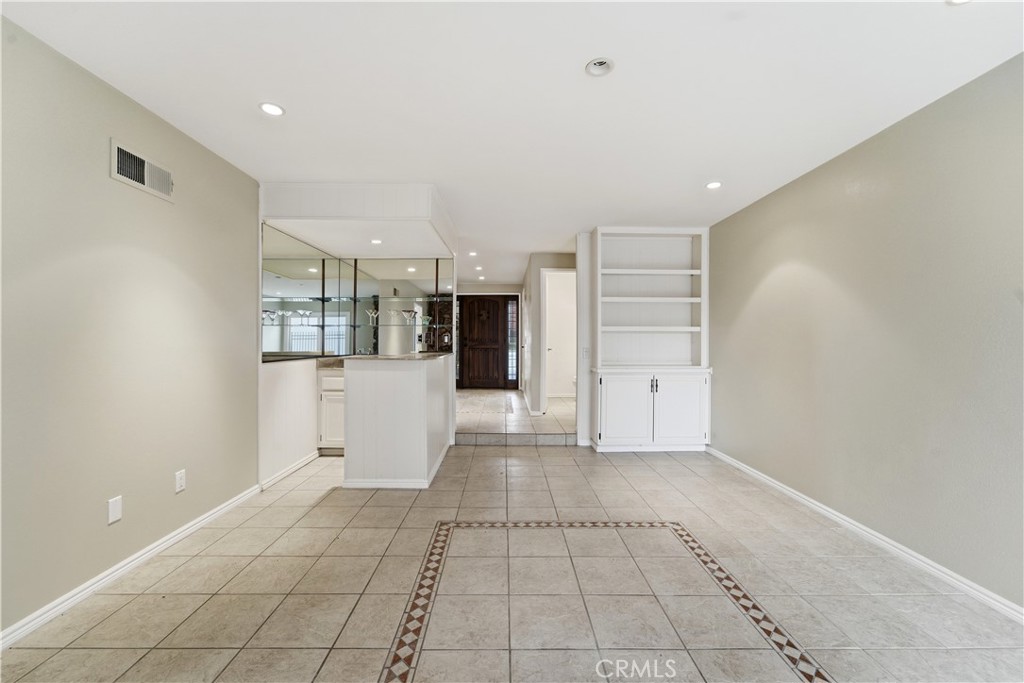 16650 Rinaldi Street Granada Hills, CA 91344 - Photo 9 of 35 a view of a kitchen with a refrigerator and a sink