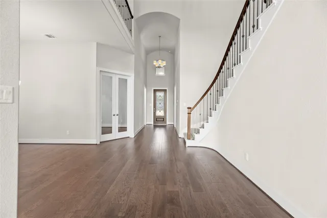 a view of an entryway with wooden floor