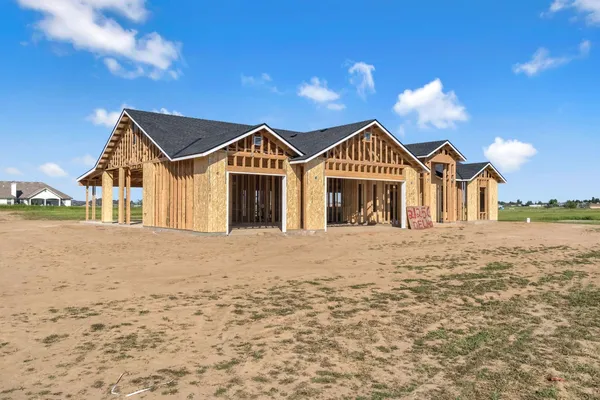 a view of a town with large trees and a big yard