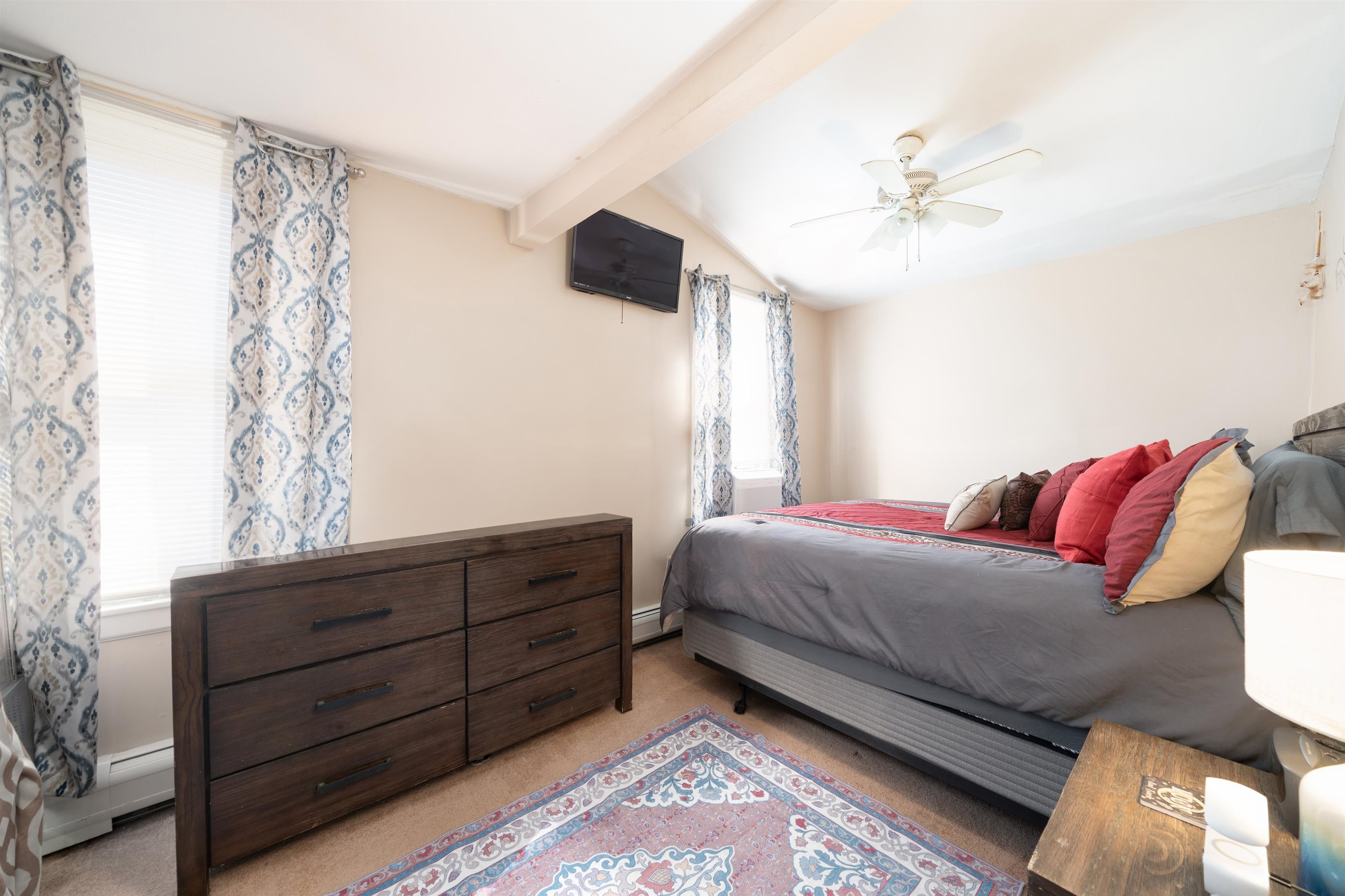 33 South Road Wayne, NJ 07470 - Photo 5 of 22 a bedroom with a bed and a chandelier