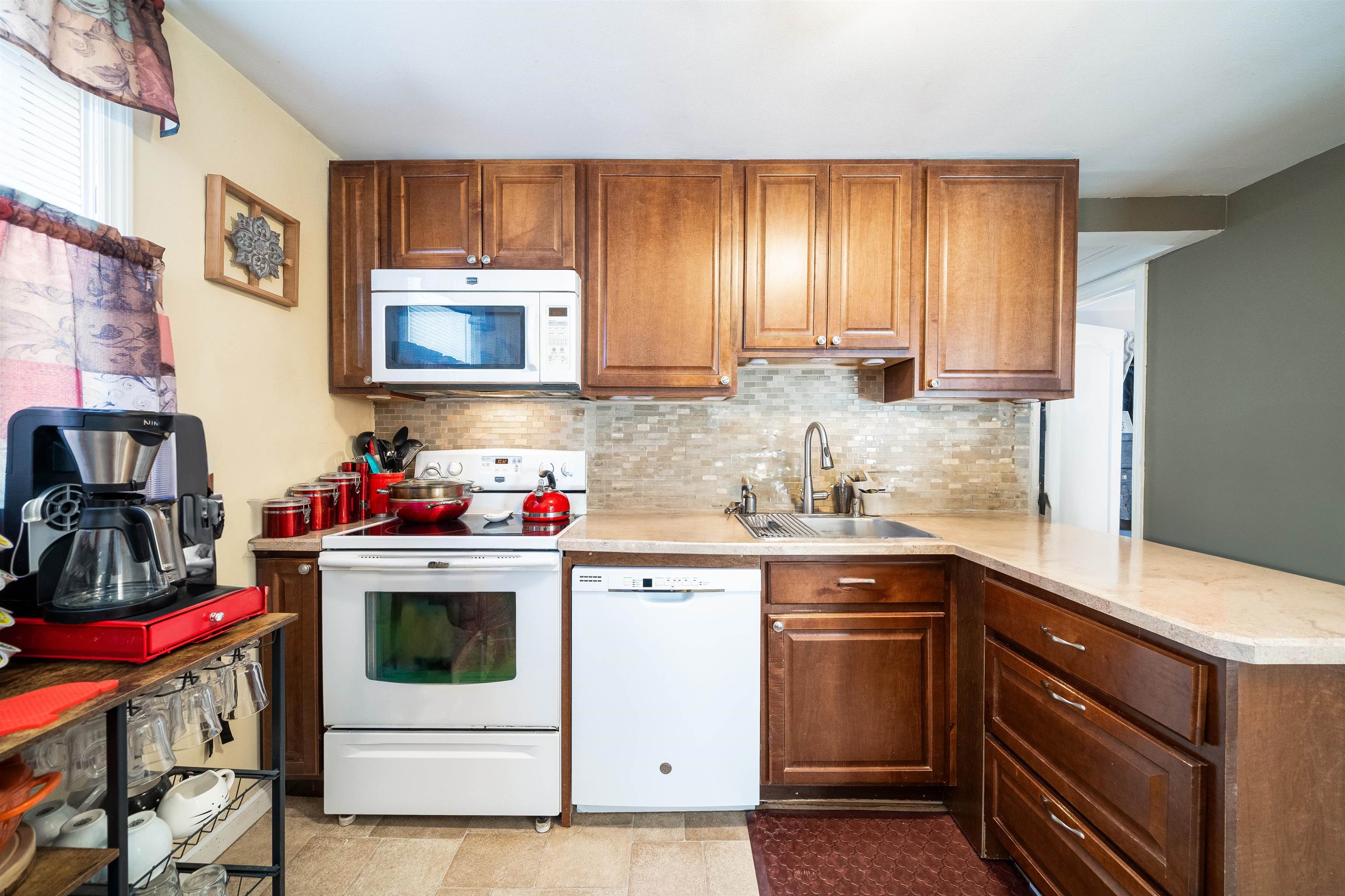 33 South Road Wayne, NJ 07470 - Photo 9 of 22 a kitchen with a sink stove and cabinets