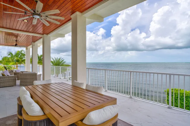 a bedroom with a bed and a potted plant