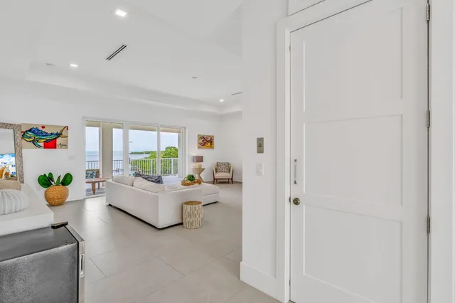 a white bath tub sitting in a bathroom next to a window