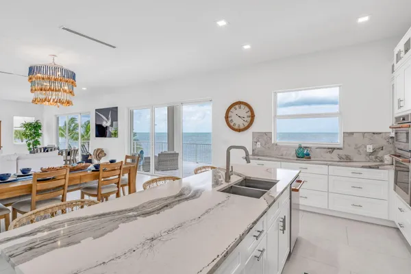 a very nice looking room with a large window and a clock