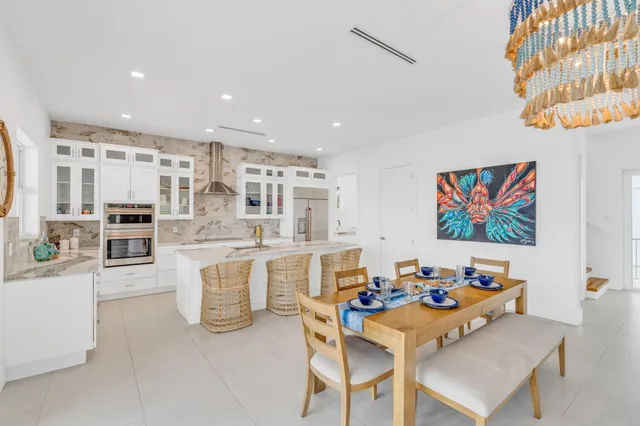 a kitchen with stainless steel appliances granite countertop a granite counter tops and a refrigerator