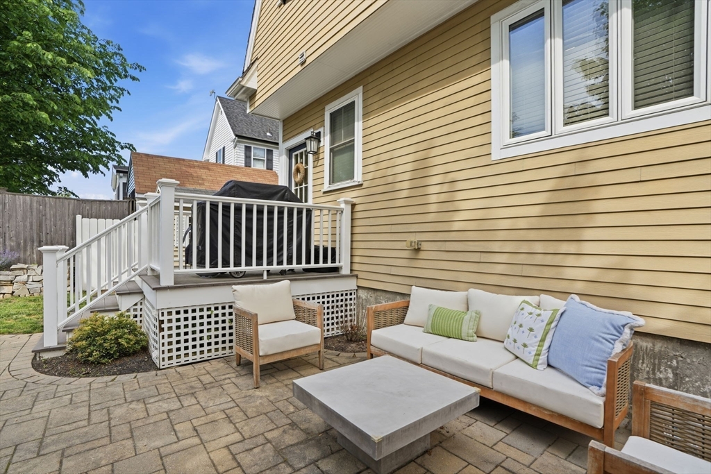 59 Elm Street Hingham, MA 02043 - Photo 28 of 33 a view of a patio with a bench