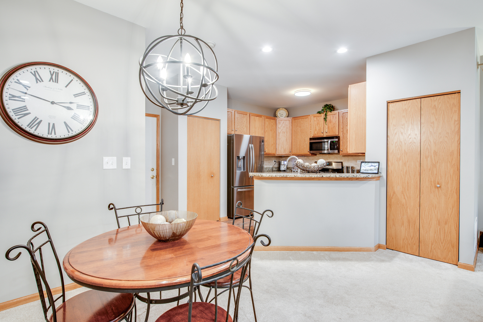 239 Springbrook Trail South Oswego, IL 60543 - Photo 5 of 20 a view of a dining room with furniture