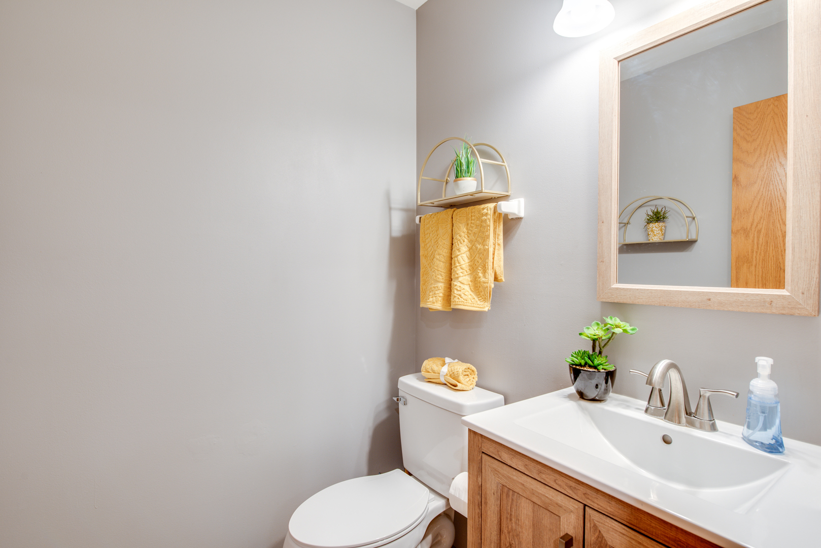 239 Springbrook Trail South Oswego, IL 60543 - Photo 10 of 20 a bathroom with a sink toilet and mirror