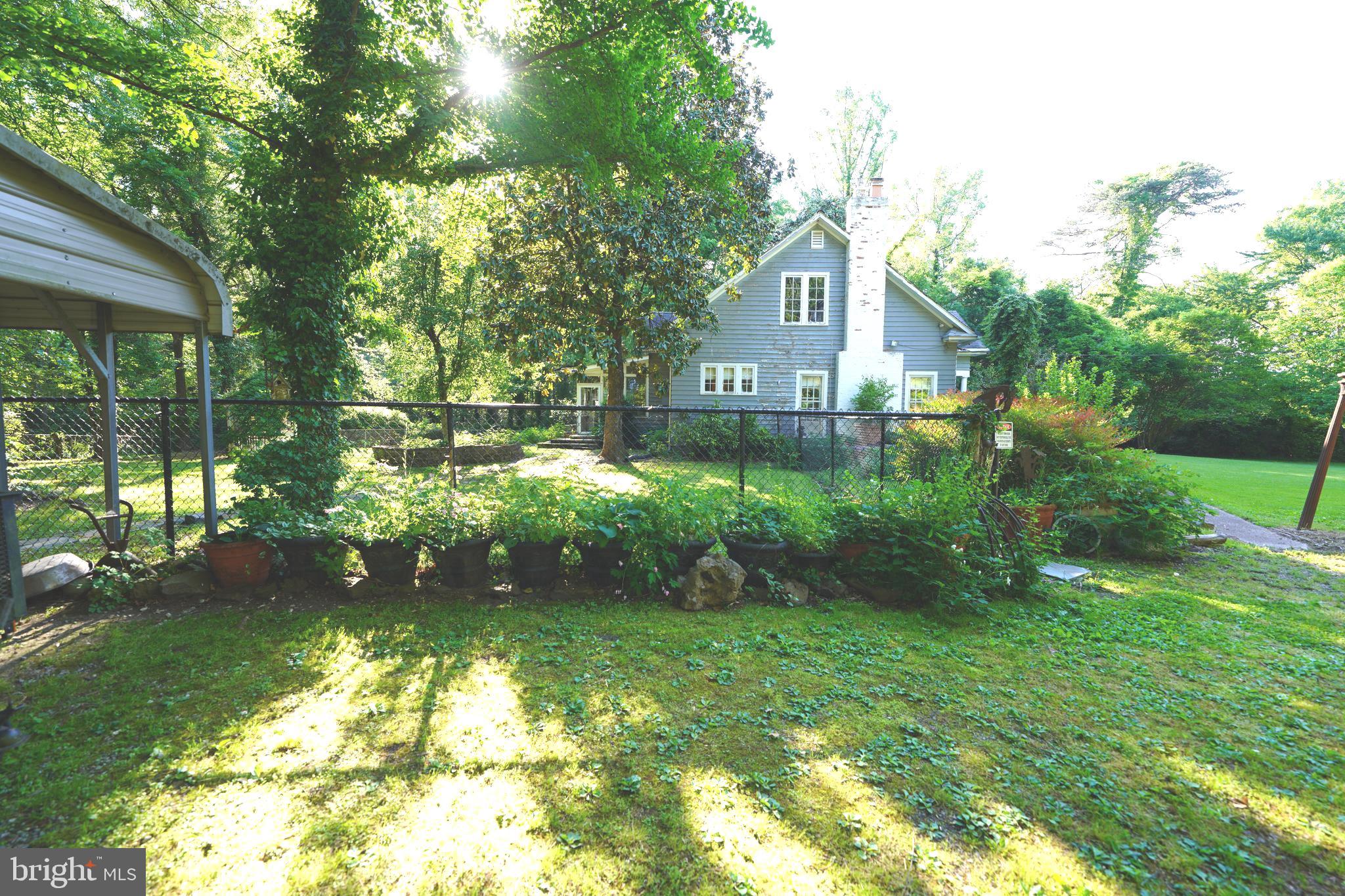 Greenbelt Road Lanham, MD 20706 - Photo 29 of 74 a front view of a house with garden