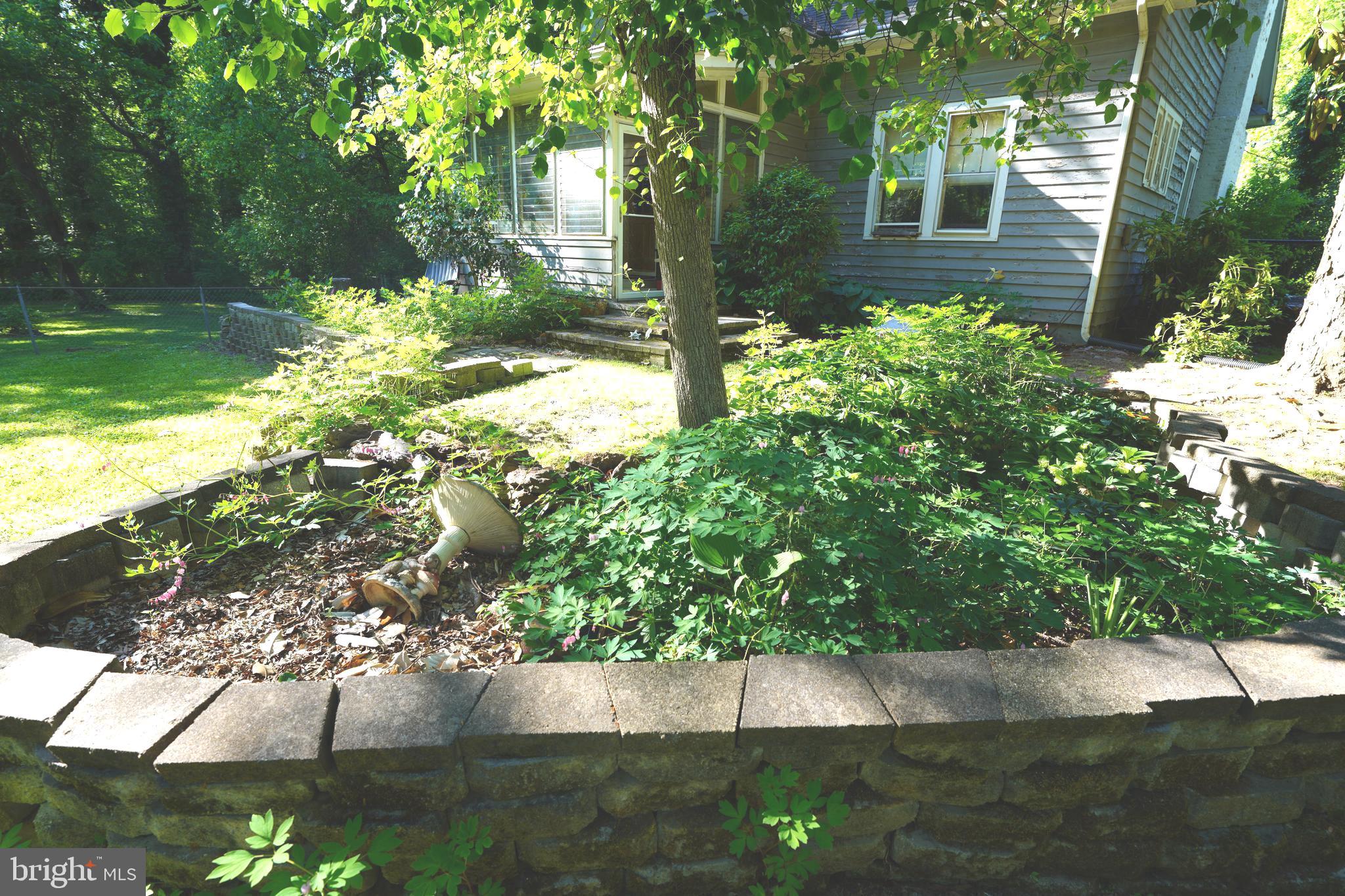 Greenbelt Road Lanham, MD 20706 - Photo 35 of 74 a view of a yard with plants and large trees
