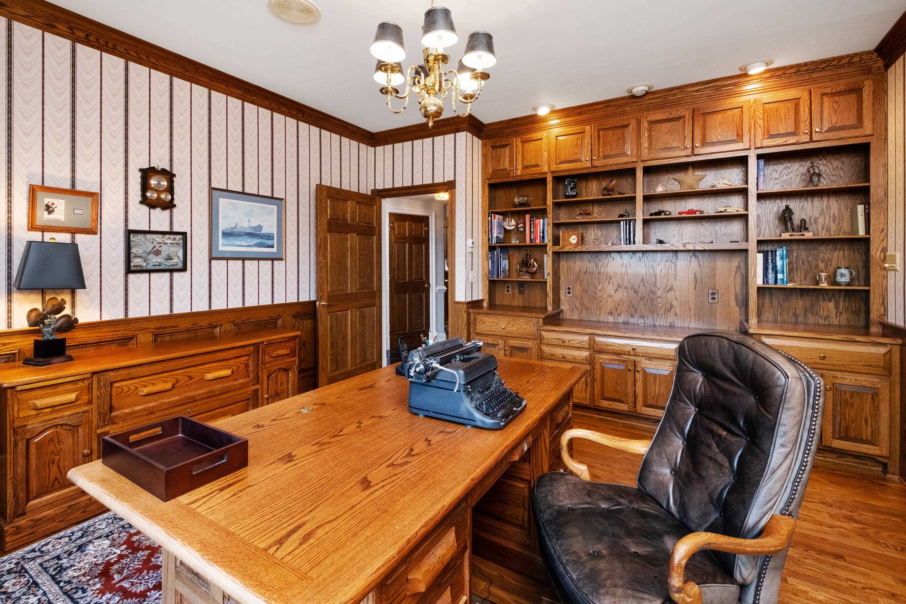 1219 Rockfish Road Waynesboro, VA 22980 - Photo 54 of 75 a room with furniture gym equipment and a chandelier