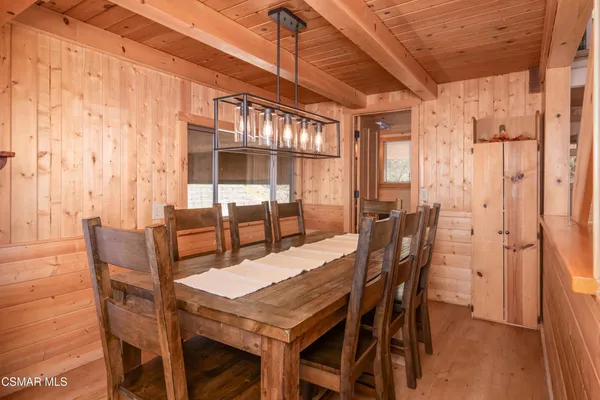 a dining room with furniture and window