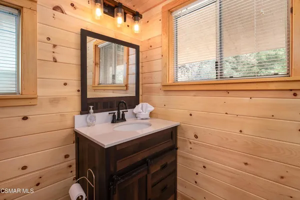 a bathroom with a sink and a window