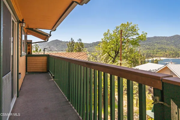 a balcony with view of outdoor space