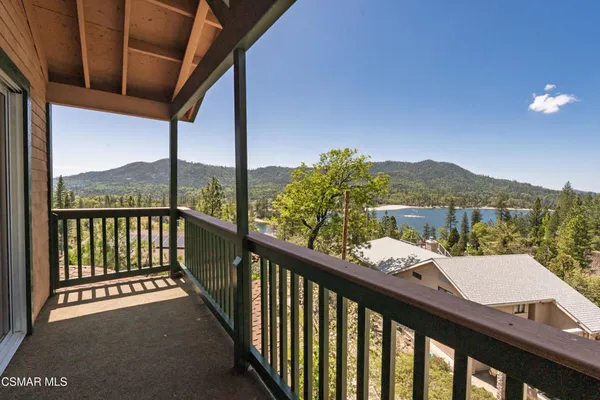 a view of a balcony with furniture