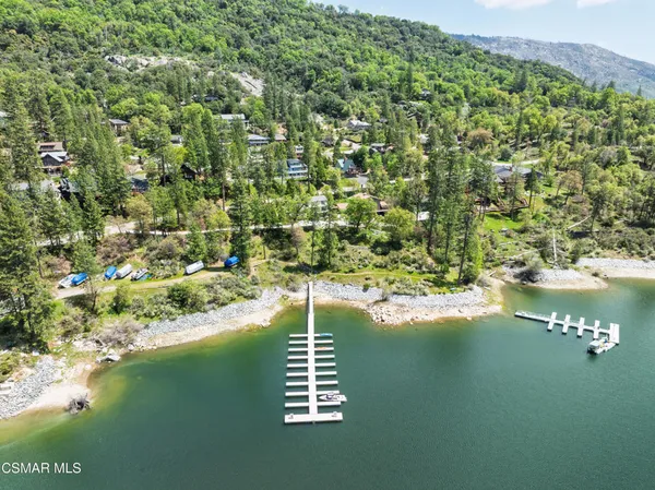 a view of a lake with a yard