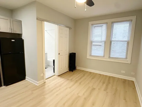a view of an empty room with a window