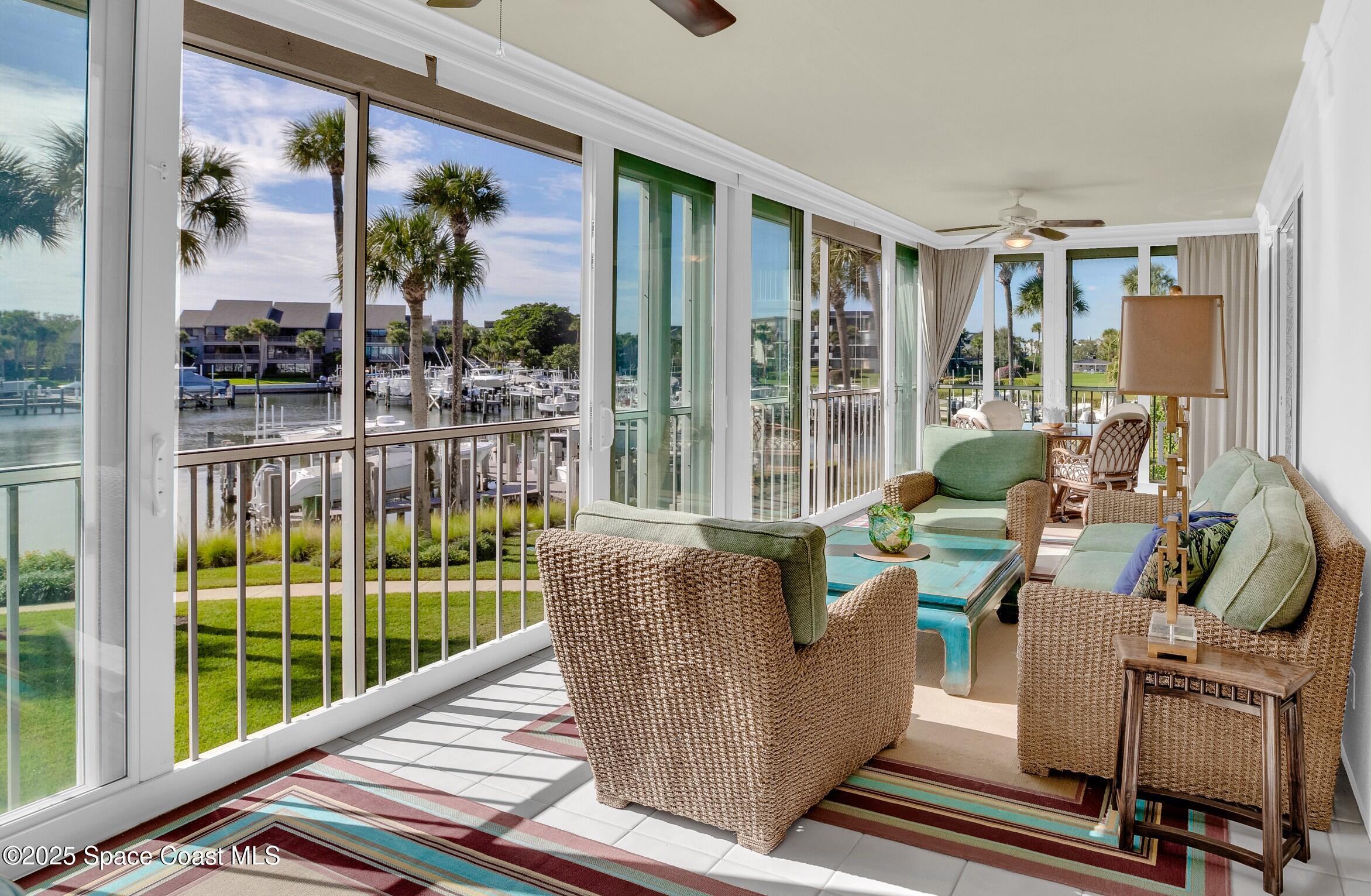 1903 Bay Road, Unit 205 Vero Beach, FL 32963 - Photo 19 of 53 a living room with furniture and a window