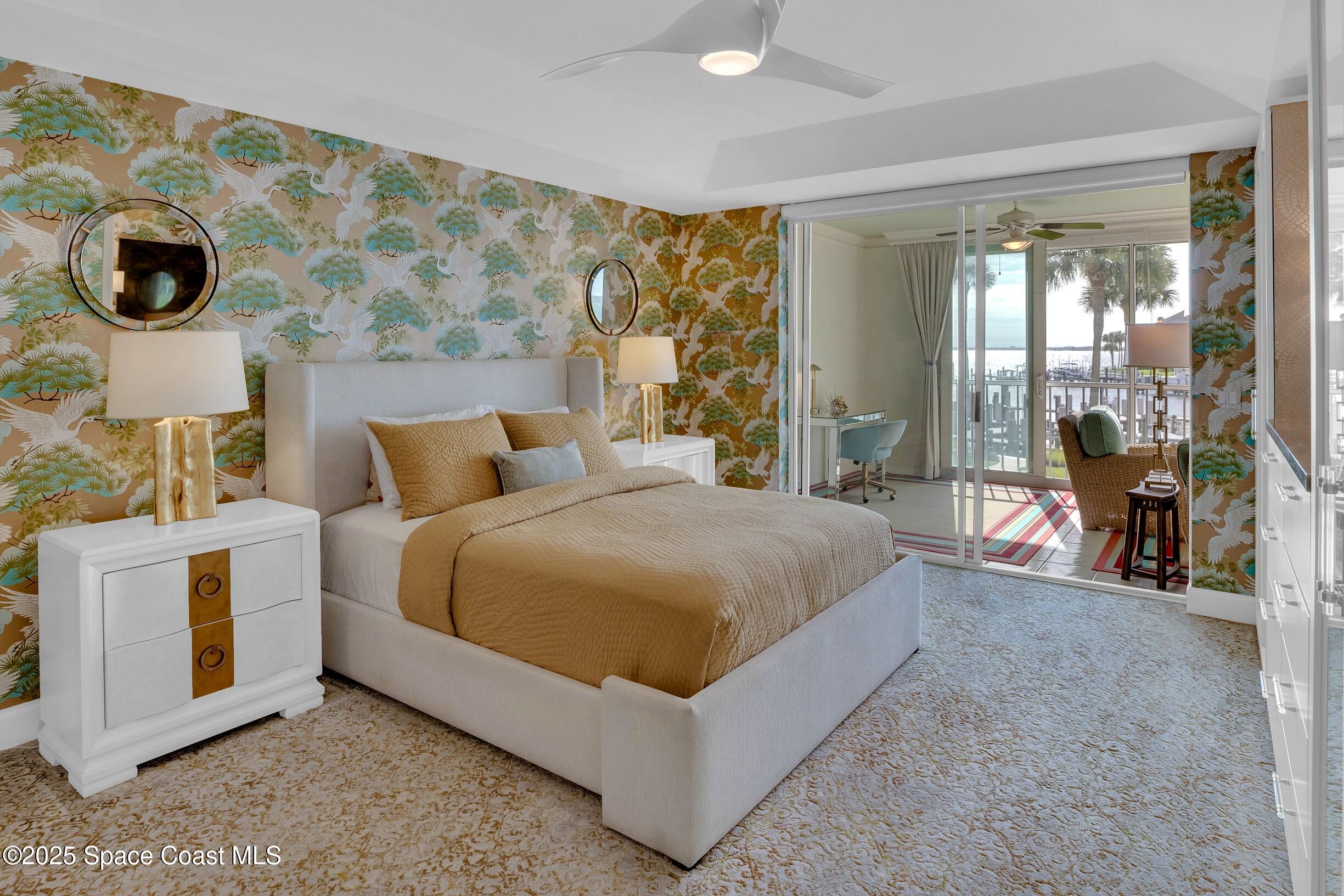 1903 Bay Road, Unit 205 Vero Beach, FL 32963 - Photo 22 of 53 a bedroom with a large bed and a large window