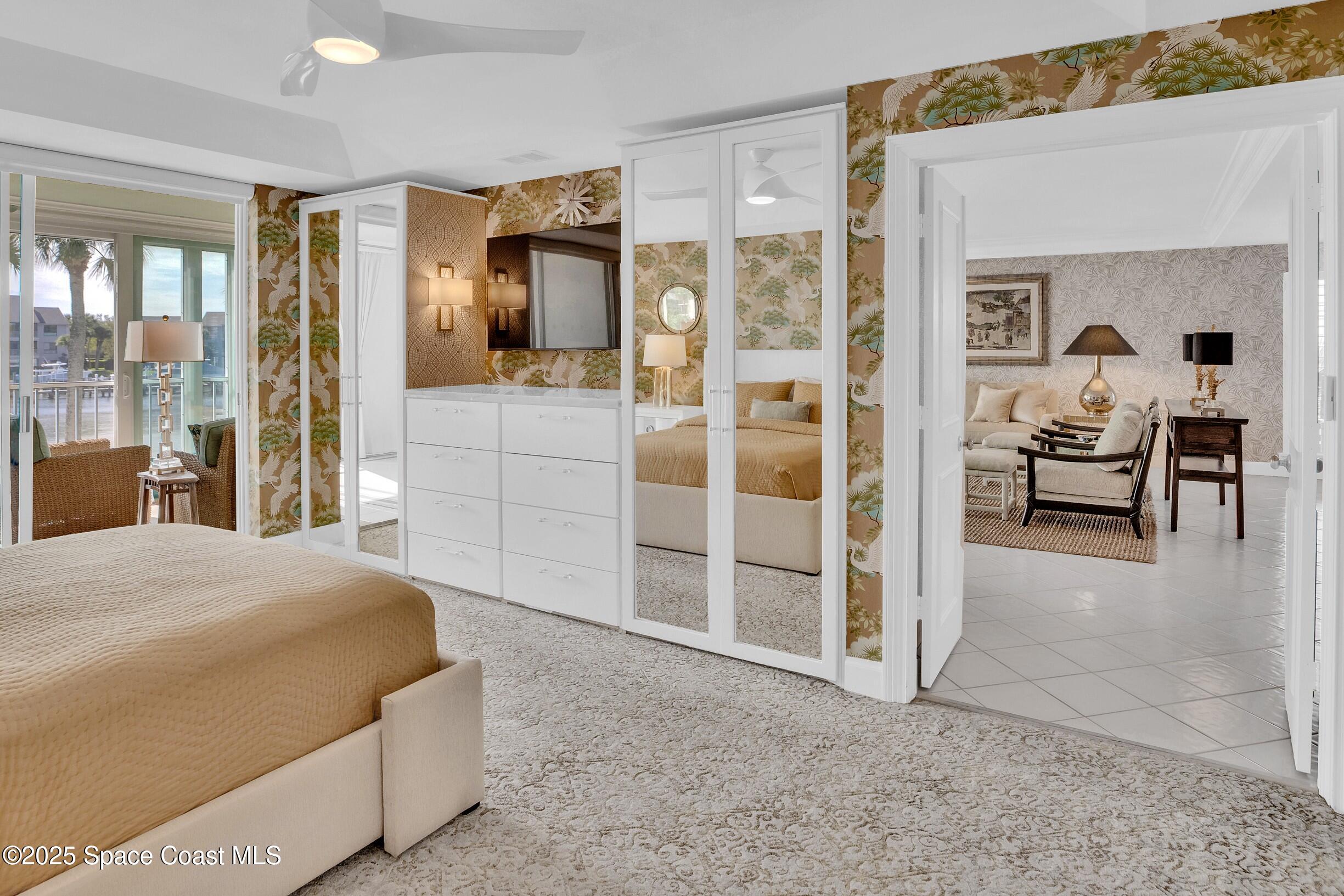 1903 Bay Road, Unit 205 Vero Beach, FL 32963 - Photo 24 of 53 a bedroom with a bed and a view of living room