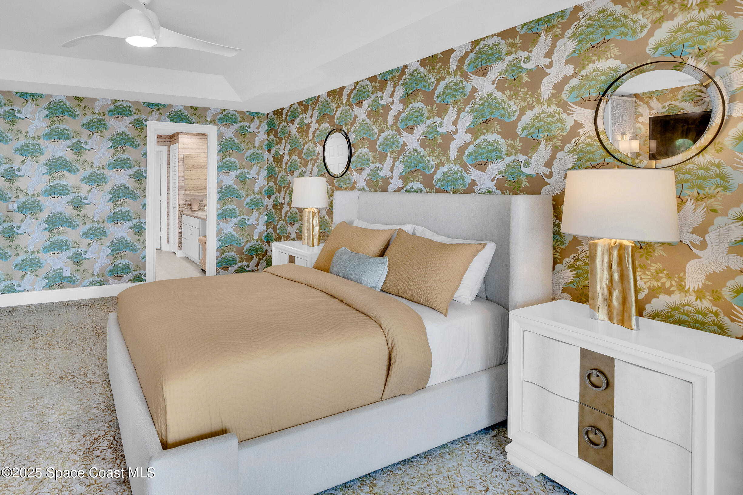 1903 Bay Road, Unit 205 Vero Beach, FL 32963 - Photo 25 of 53 a bedroom with a bed and a lamp