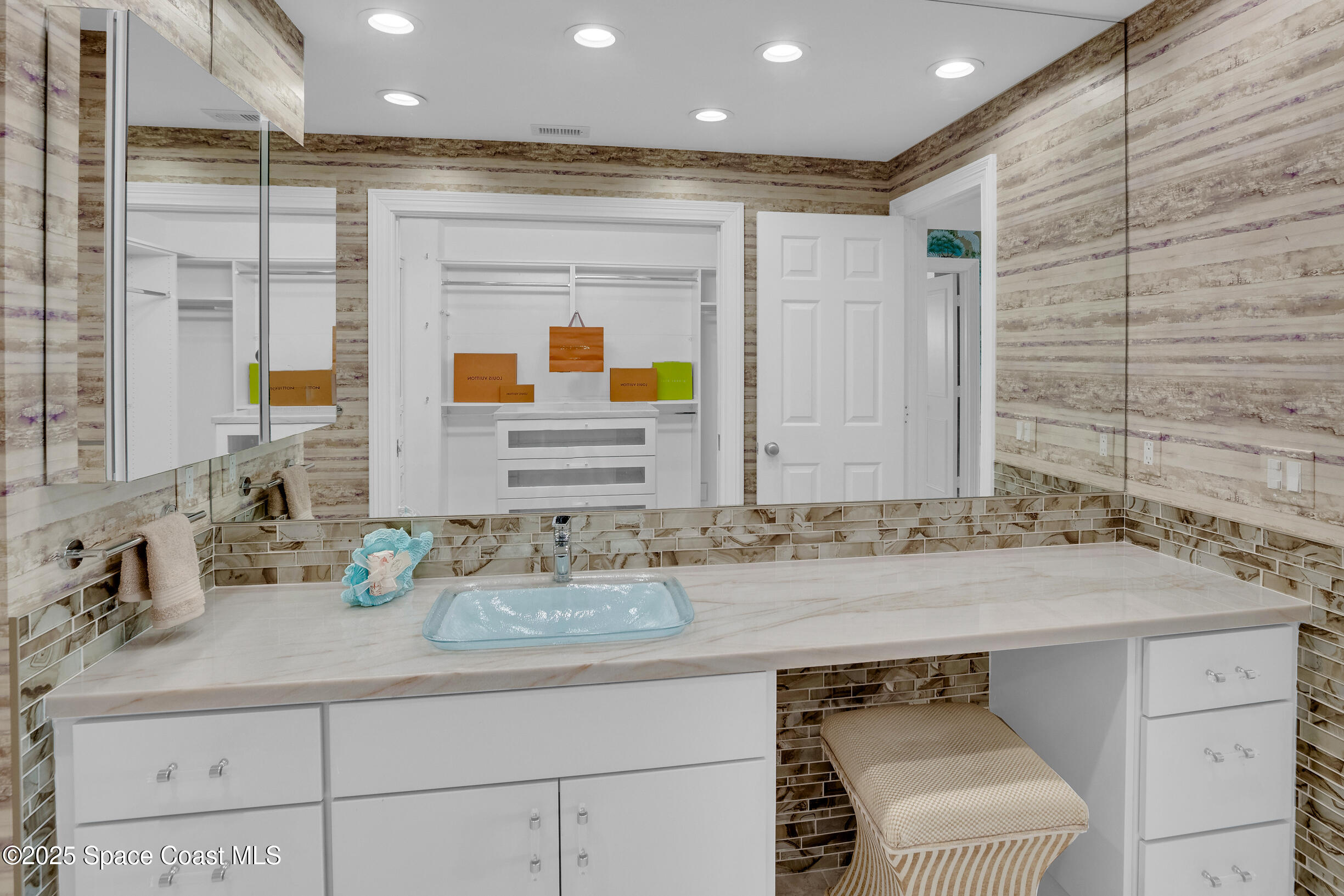 1903 Bay Road, Unit 205 Vero Beach, FL 32963 - Photo 28 of 53 a bathroom with a sink and a mirror