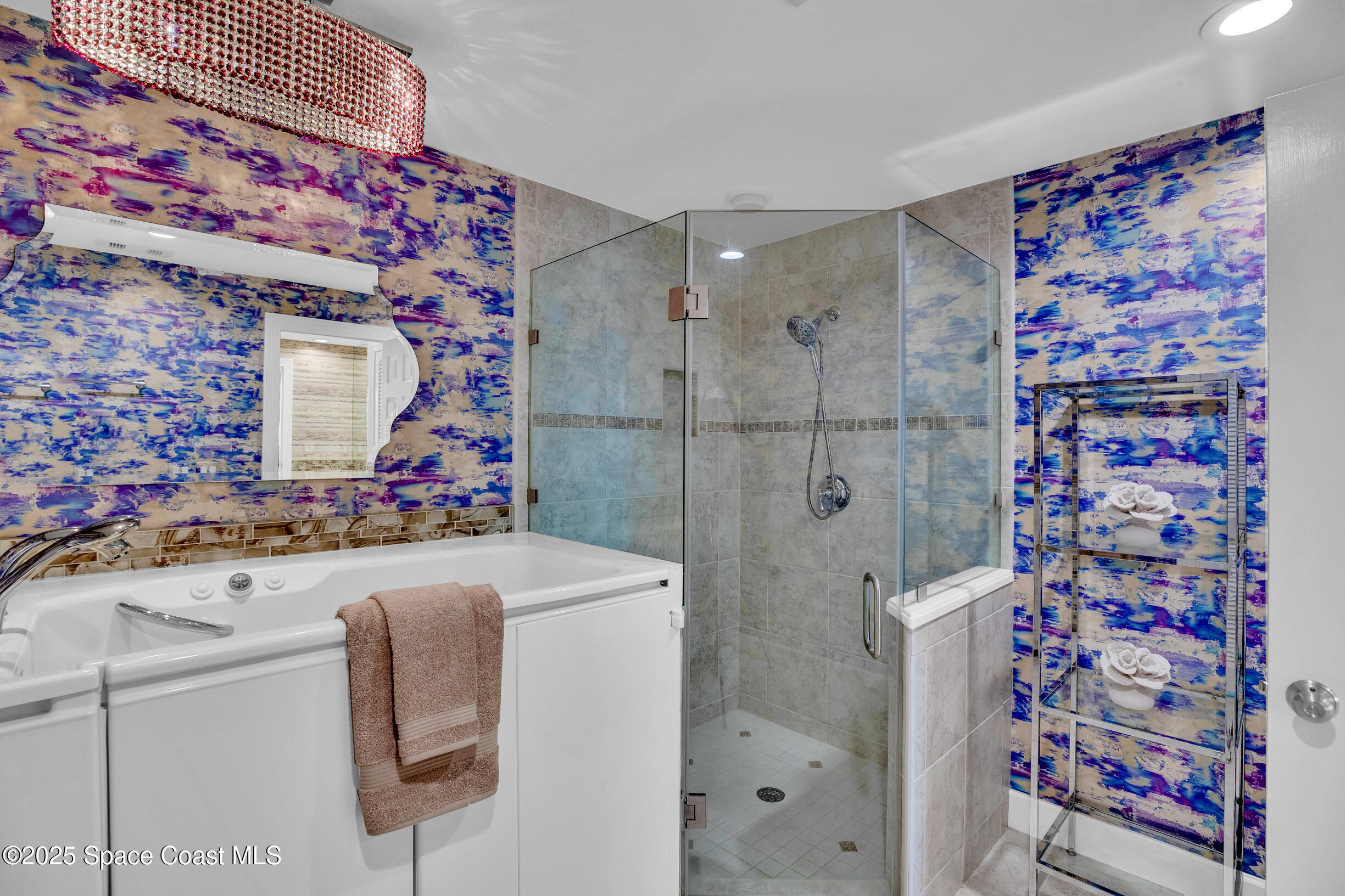1903 Bay Road, Unit 205 Vero Beach, FL 32963 - Photo 33 of 53 a bathroom with a sink toilet and shower