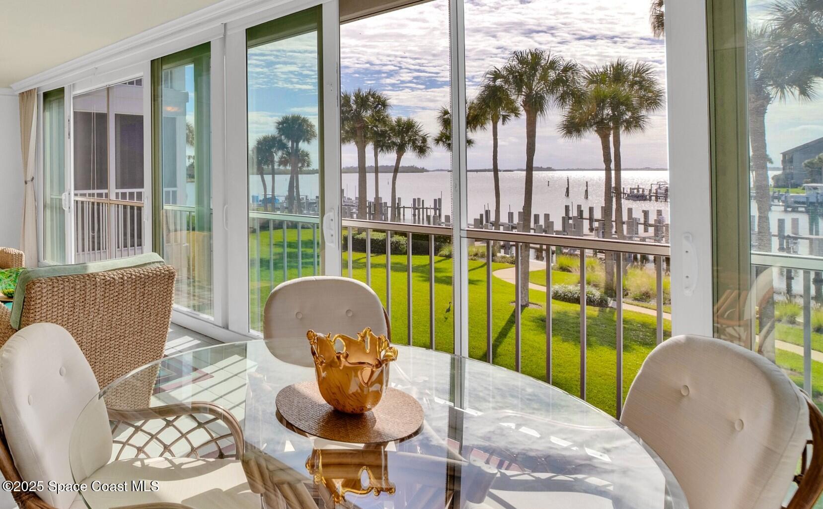 1903 Bay Road, Unit 205 Vero Beach, FL 32963 - Photo 4 of 53 a living room with furniture and a garden