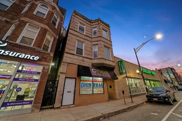 a view of a car park in front of building