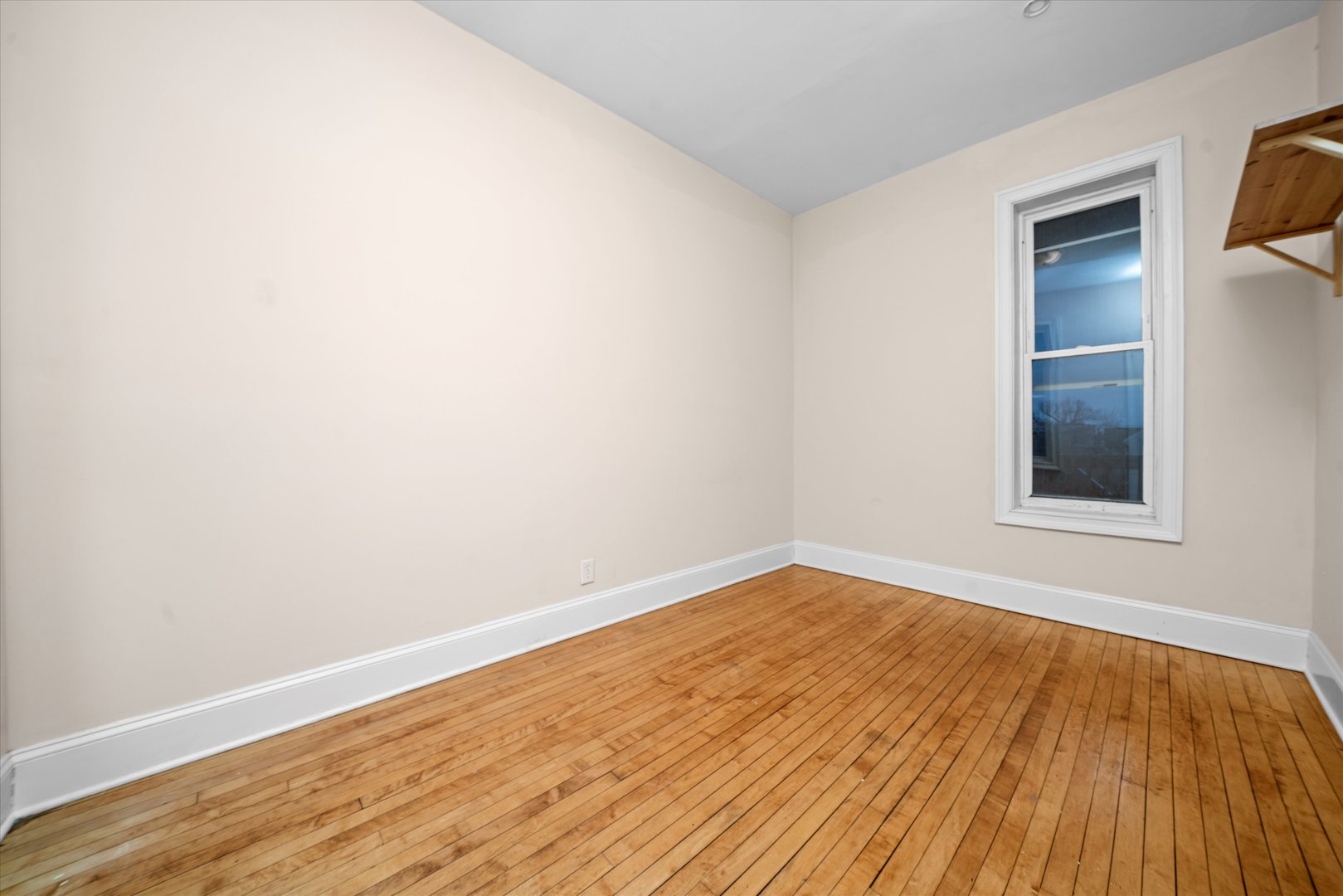 2128 West Cermak Road Chicago, IL 60608 - Photo 13 of 16 an empty room with wooden floor and windows