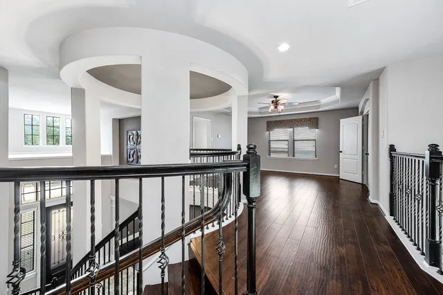 a view of an entryway with wooden floor