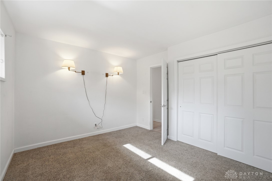 629 Storms Road Dayton, OH 45429 - Photo 31 of 51 This bright and airy bedroom features soft carpeting and ample closet space.