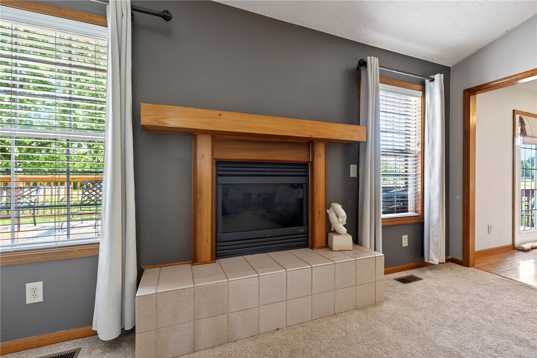 4996 Shannon Avenue Springfield, OH 45504 - Photo 23 of 61 This inviting living space features a cozy fireplace, perfect for relaxing evenings at home.