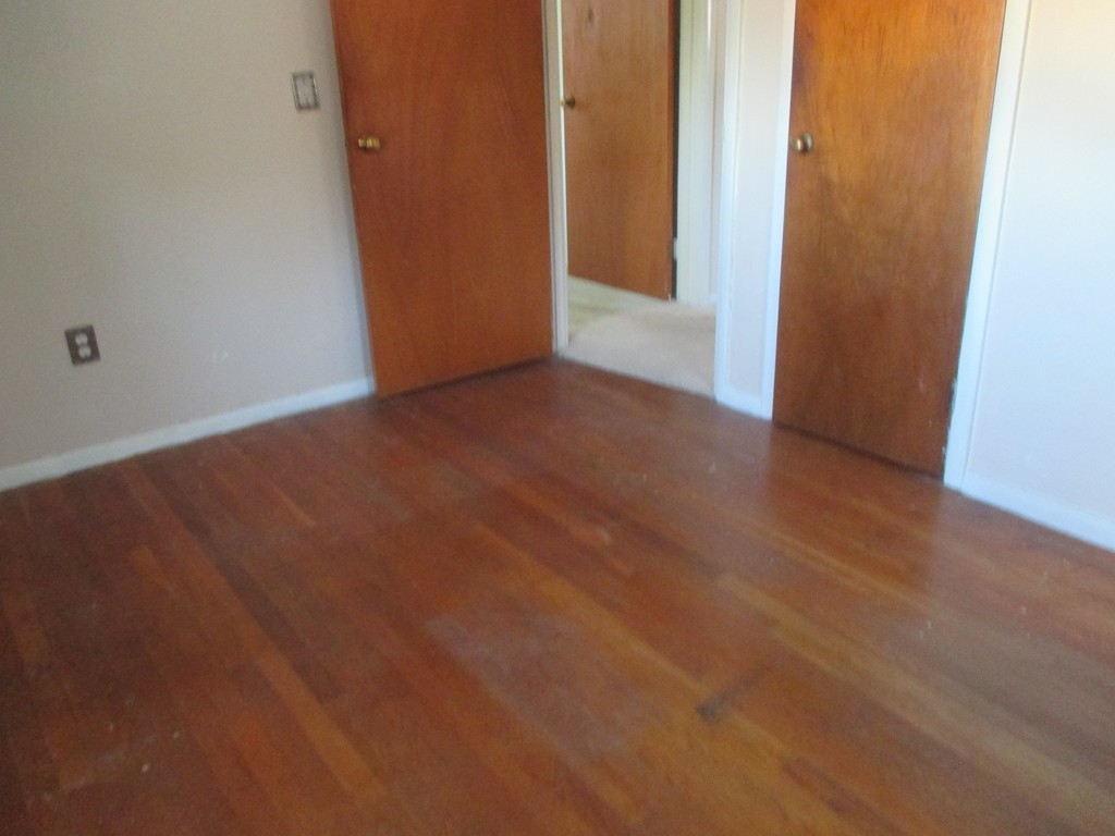 12 Locke Road Billerica, MA 01821 - Photo 11 of 16 an empty room with wooden floor