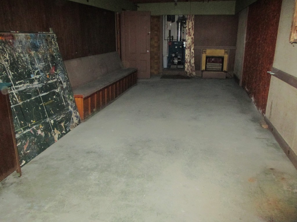 12 Locke Road Billerica, MA 01821 - Photo 13 of 16 a view of water heater room with fireplace