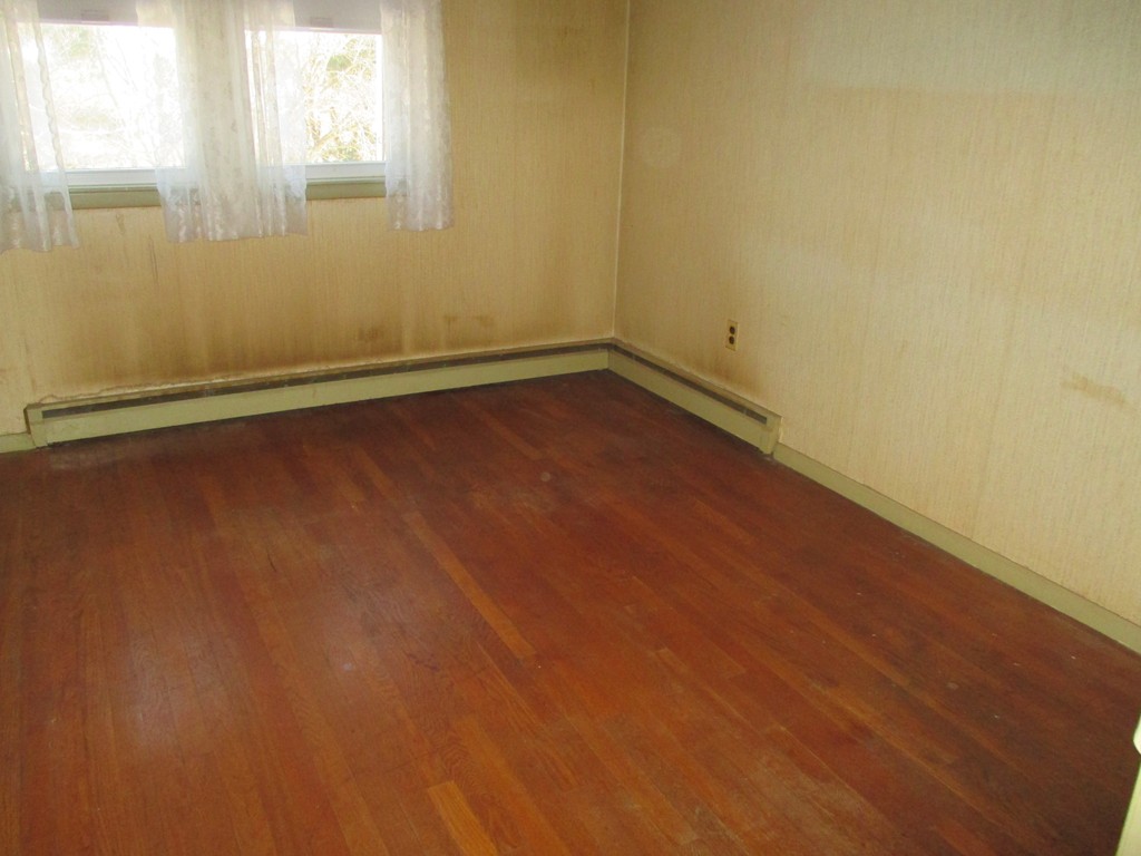 12 Locke Road Billerica, MA 01821 - Photo 5 of 16 an empty room with a window