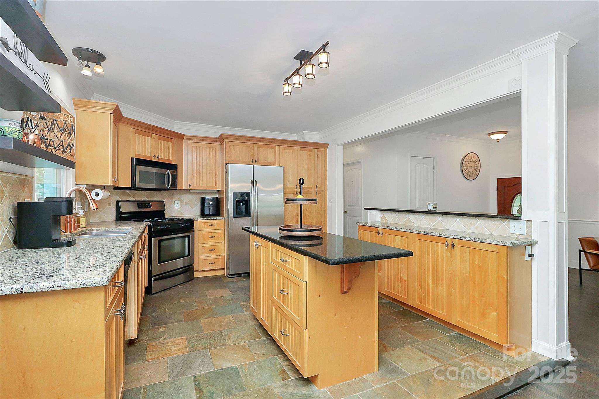 6500 Old Providence Road Charlotte, NC 28226 - Photo 13 of 40 a kitchen with stainless steel appliances granite countertop a stove oven and a refrigerator