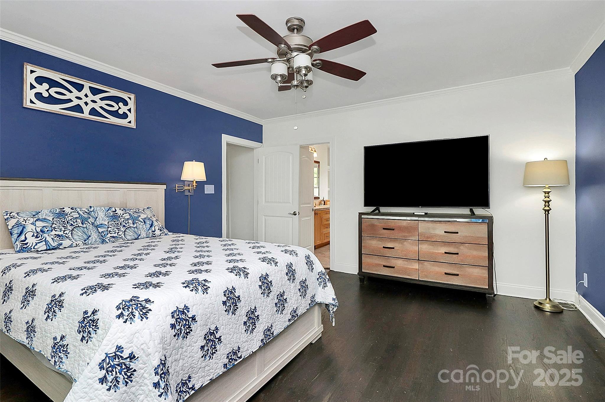 6500 Old Providence Road Charlotte, NC 28226 - Photo 16 of 40 a bedroom with a bed and a flat tv screen on dresser