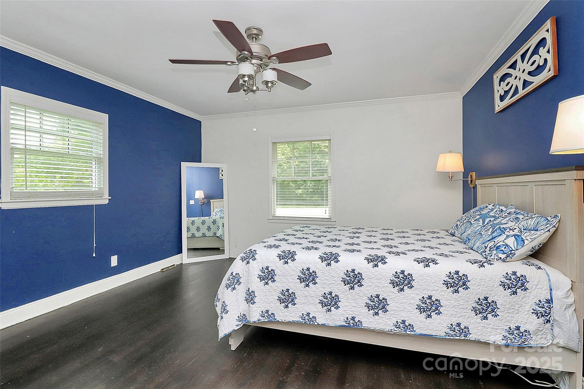 6500 Old Providence Road Charlotte, NC 28226 - Photo 18 of 40 a bedroom with a bed and a chandelier