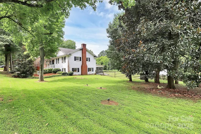 a view of a house with a big yard