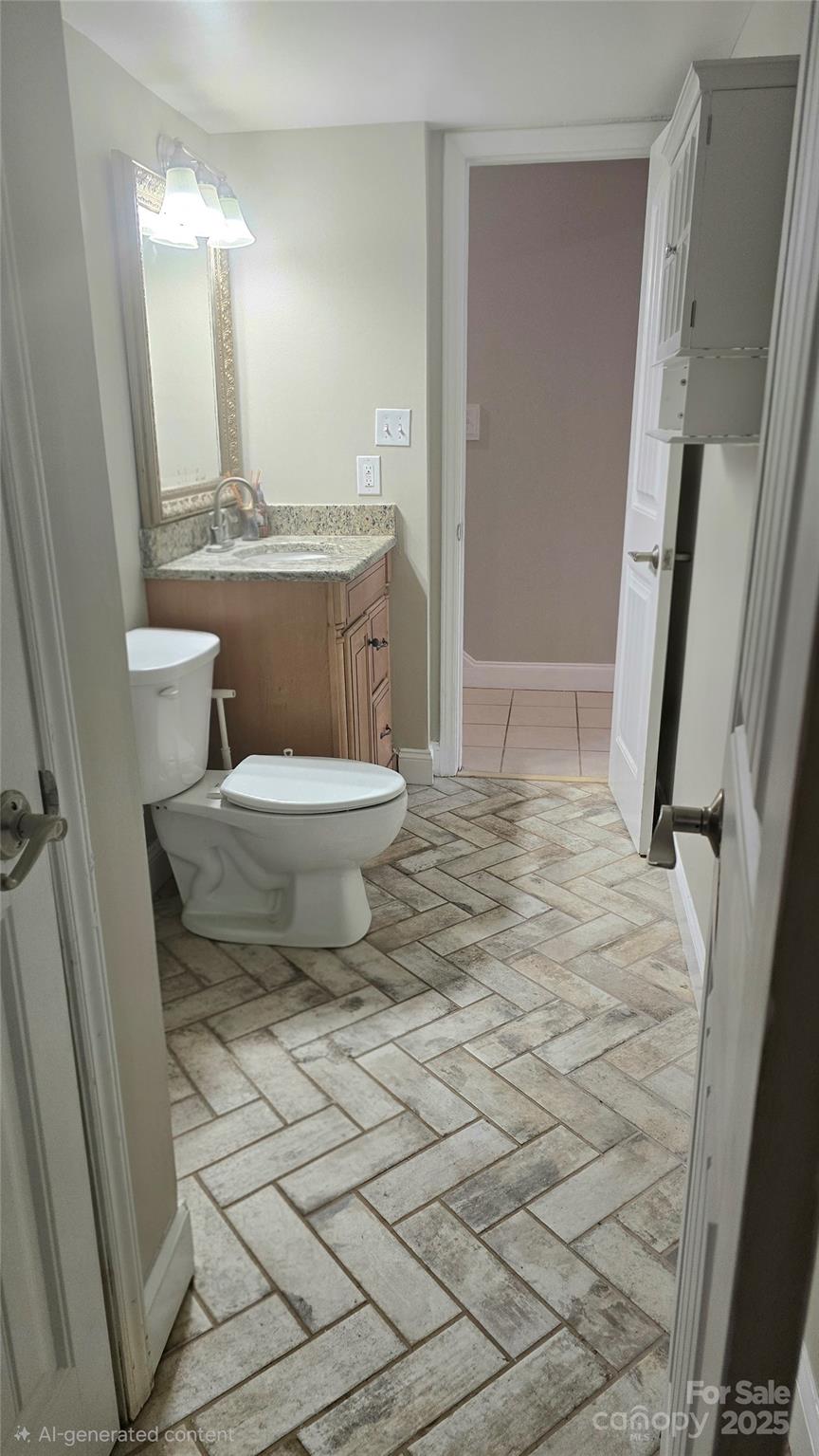 6500 Old Providence Road Charlotte, NC 28226 - Photo 33 of 40 a bathroom with a toilet a sink and a mirror