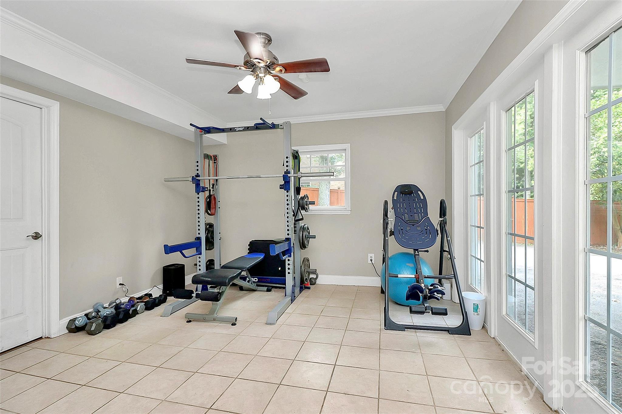 6500 Old Providence Road Charlotte, NC 28226 - Photo 34 of 40 a room with gym equipment and view of living room