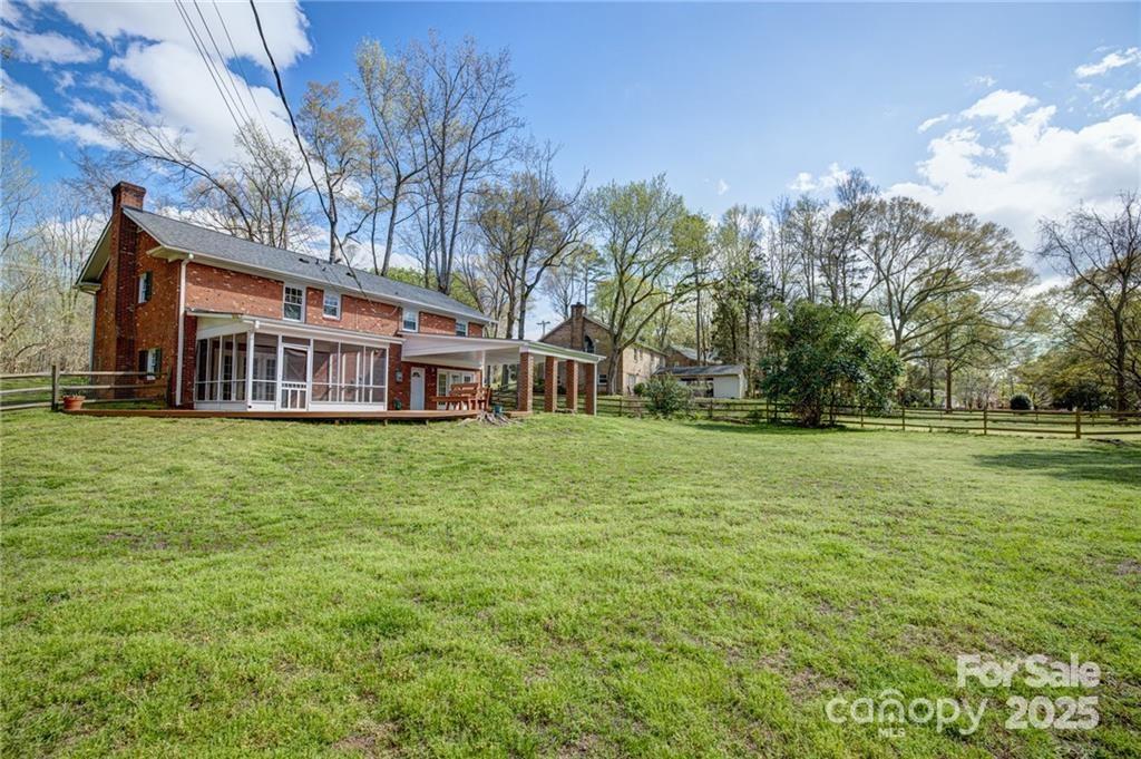 6500 Old Providence Road Charlotte, NC 28226 - Photo 40 of 40 a front view of a house with a garden
