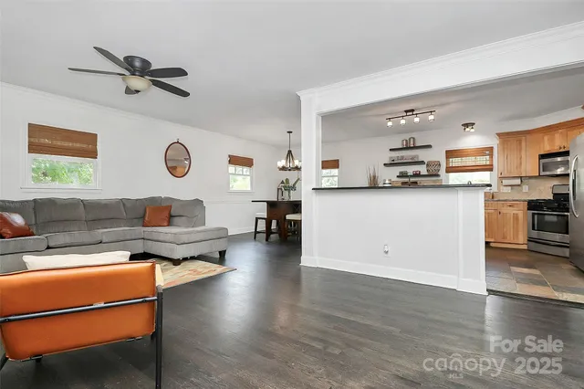 a kitchen with stainless steel appliances a stove sink and microwave